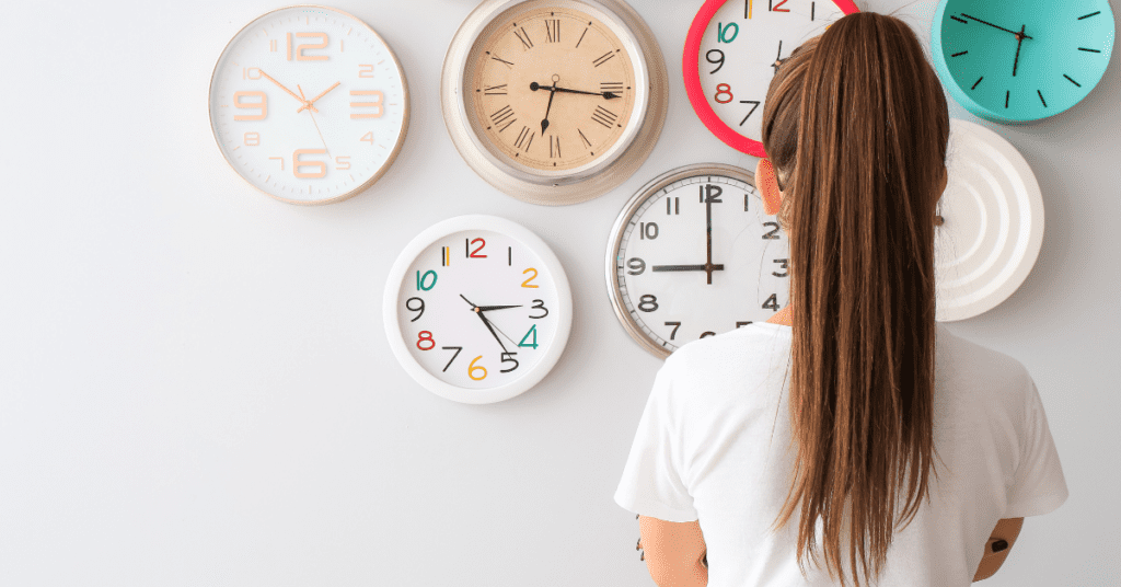 woman looking at clocks